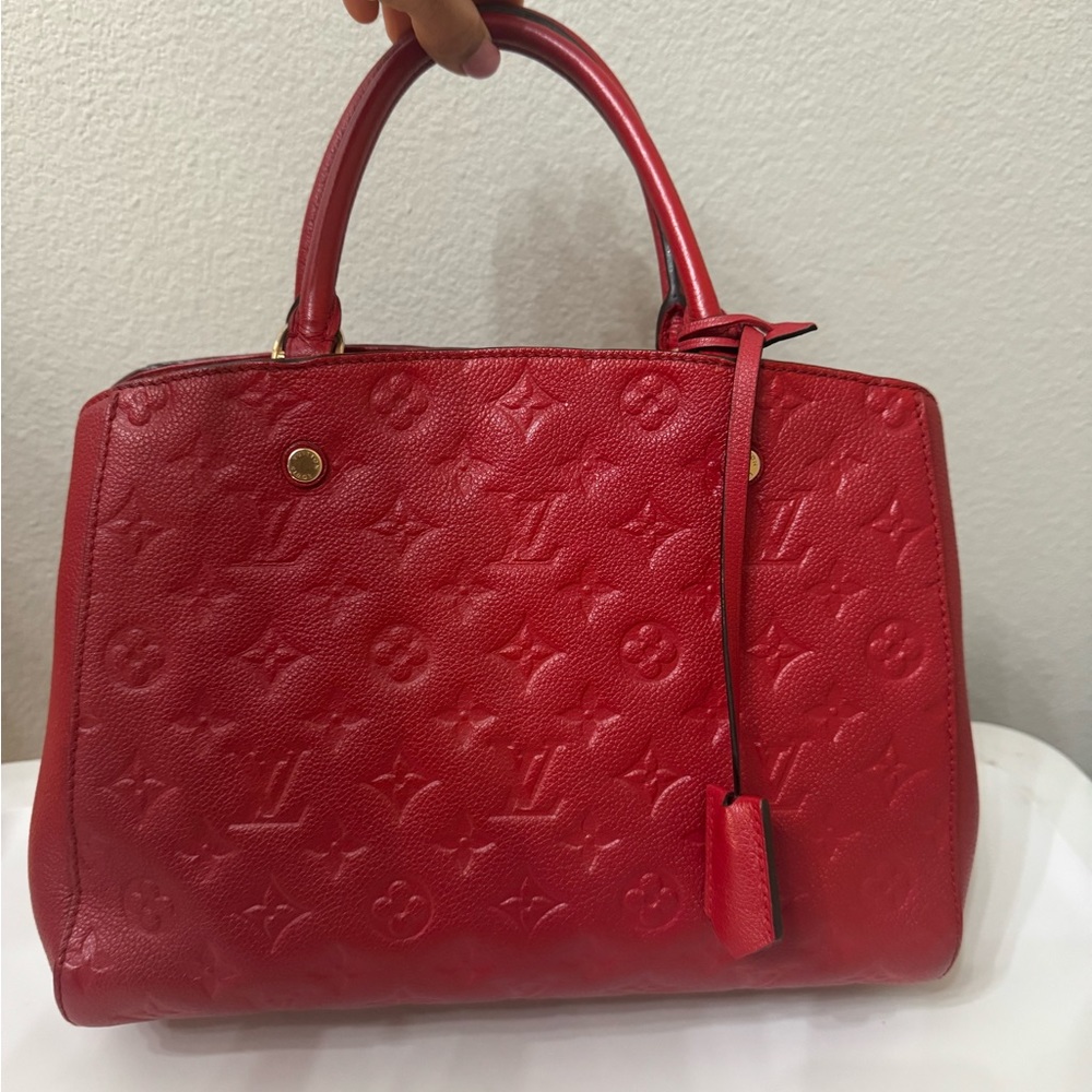 LOUIS VUITTON
Cerise Monogram Empreinte Leather Montaigne MM Bag
Comes with COA